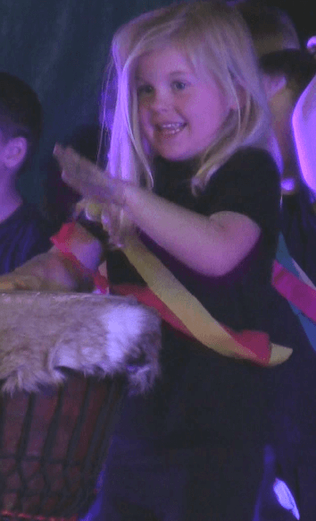Little Girl playing drum incursions